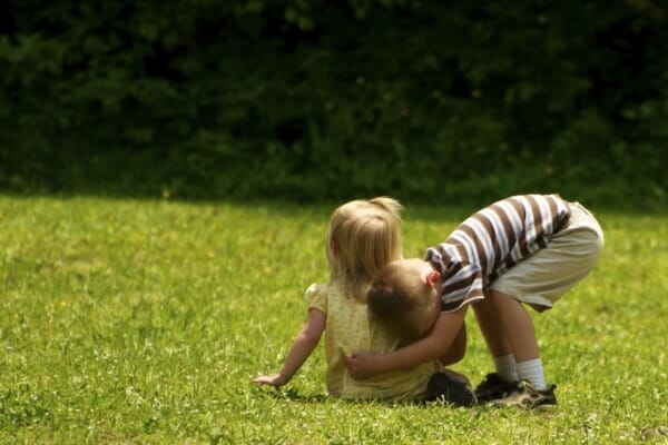 Boy hugging girl