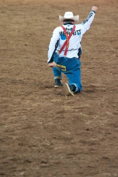 Cowboy clown on one knee